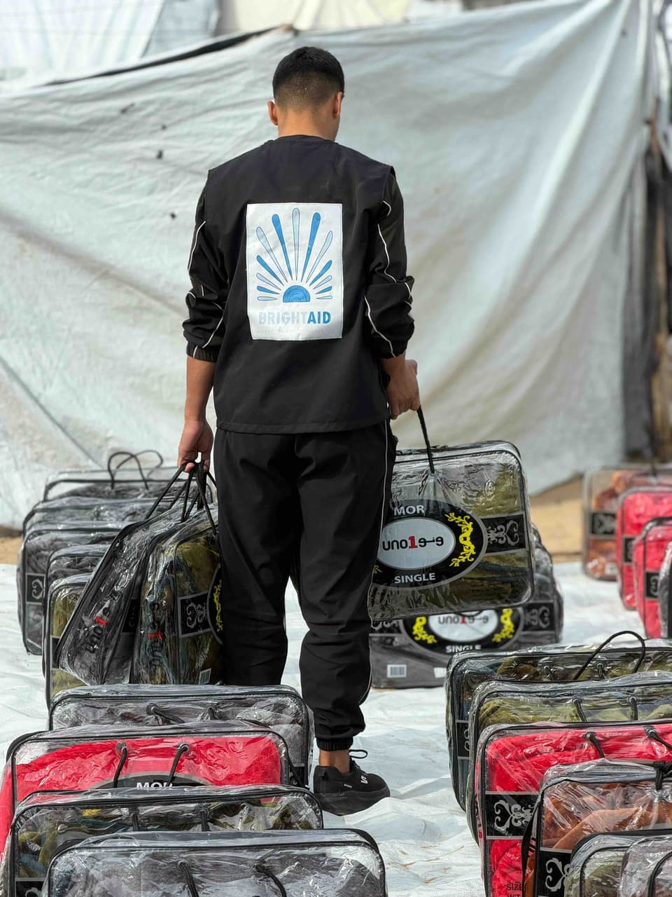 BrightAid field coordinator wearing a branded relief vest